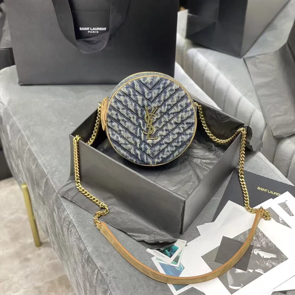 Side angle showing zip closure and strap of Saint Laurent crossbody bag