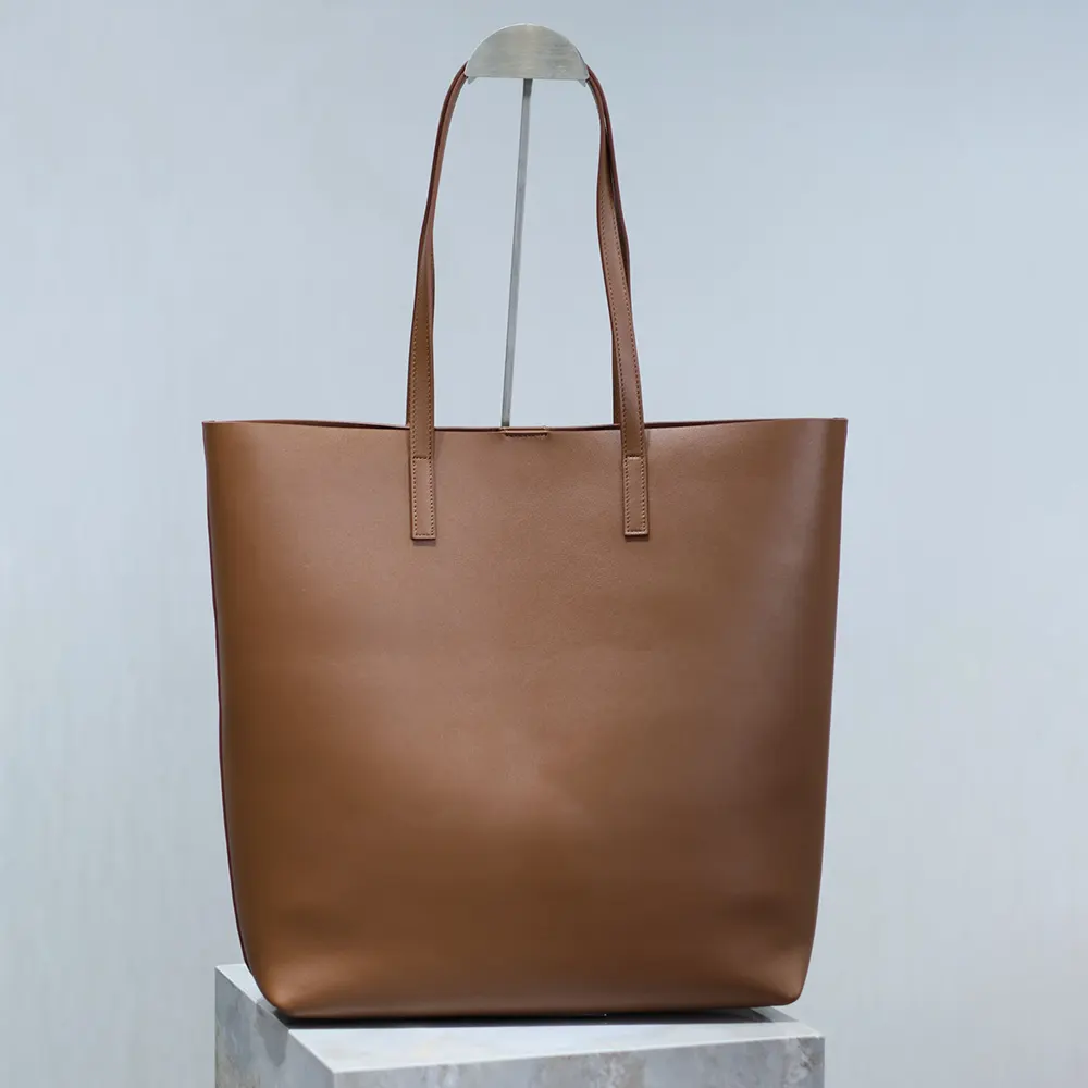 Side angle showing smooth leather texture on Saint Laurent YSL Women Shopping bag