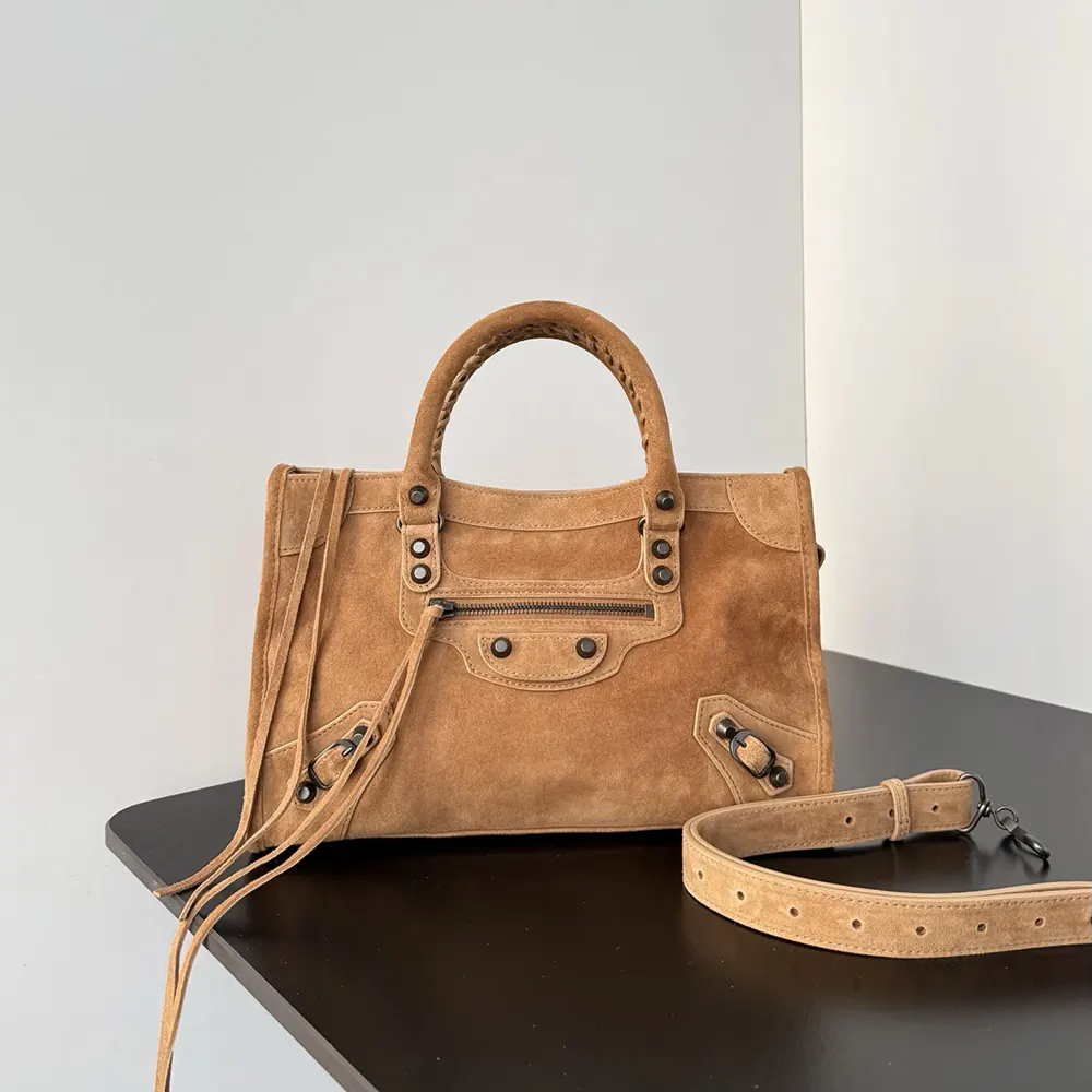 Close-up of brushed gold-tone hardware on Balenciaga Le City Bag