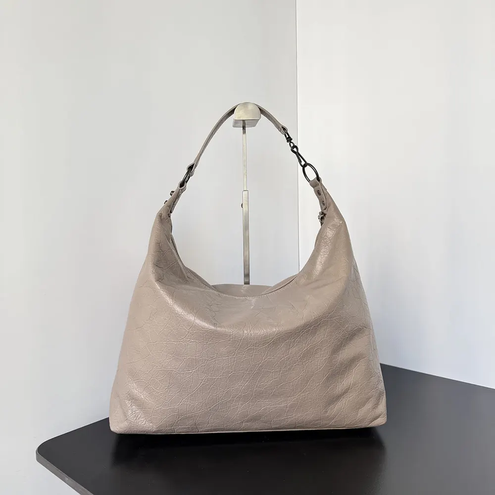 Side profile showing silhouette of Balenciaga Women Le City Hobo Bag Medium in Sesame