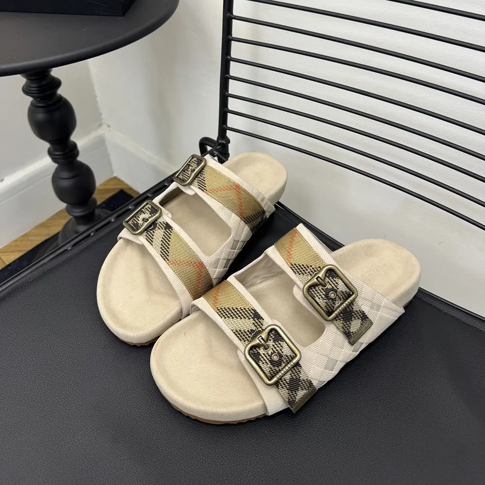 Close-up of Burberry check pattern and gold-tone buckle detail