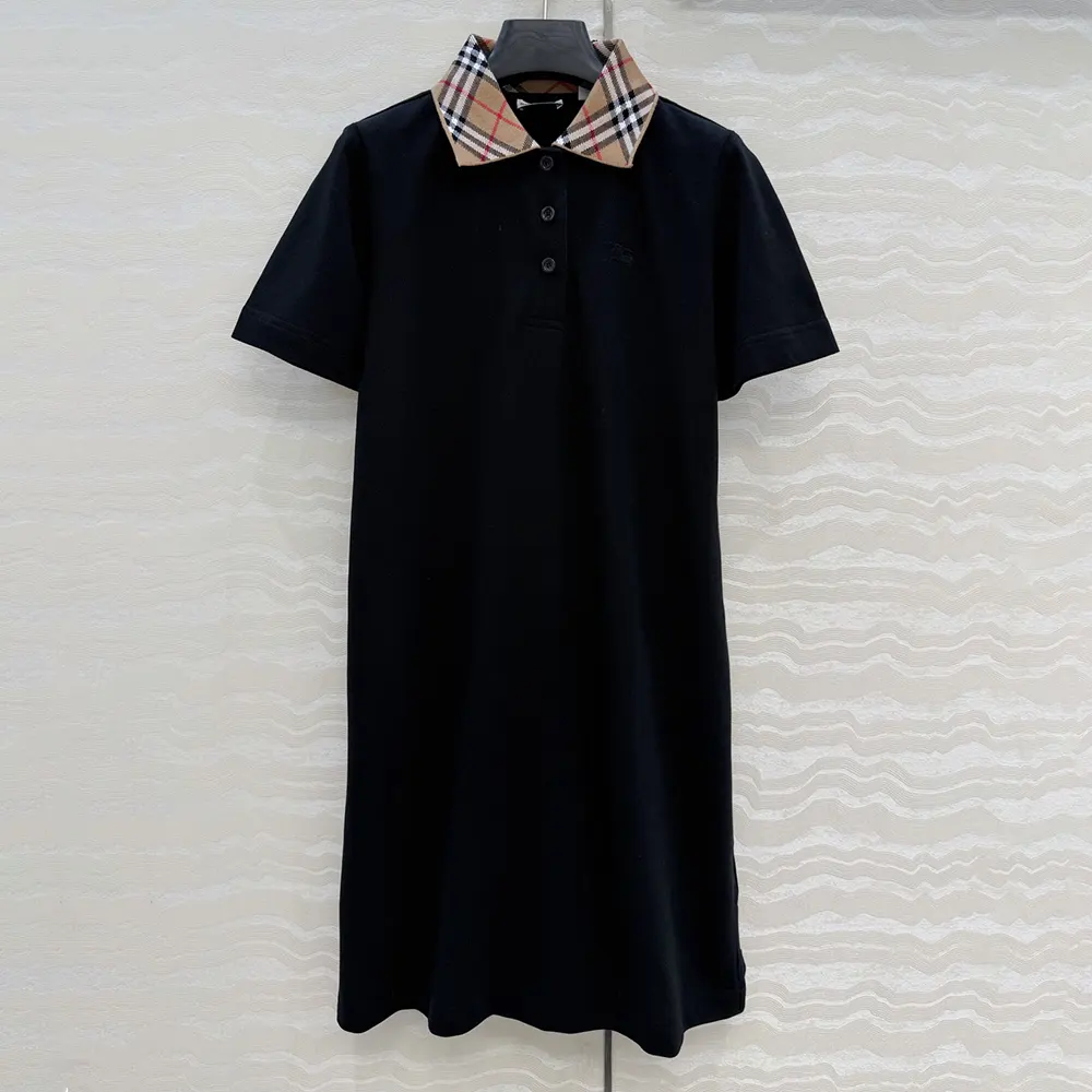 Close-up of Burberry check collar on black polo shirt dress