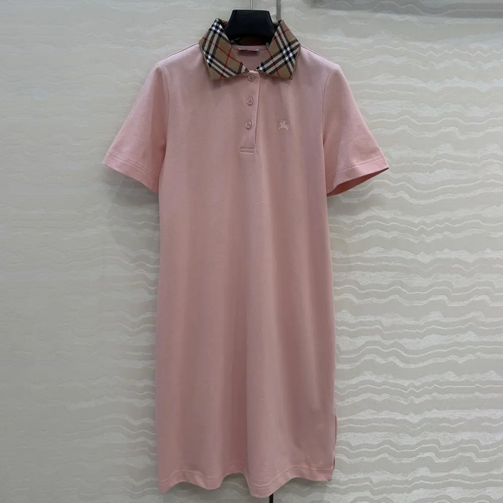 Close-up of signature check collar on pink Burberry polo dress