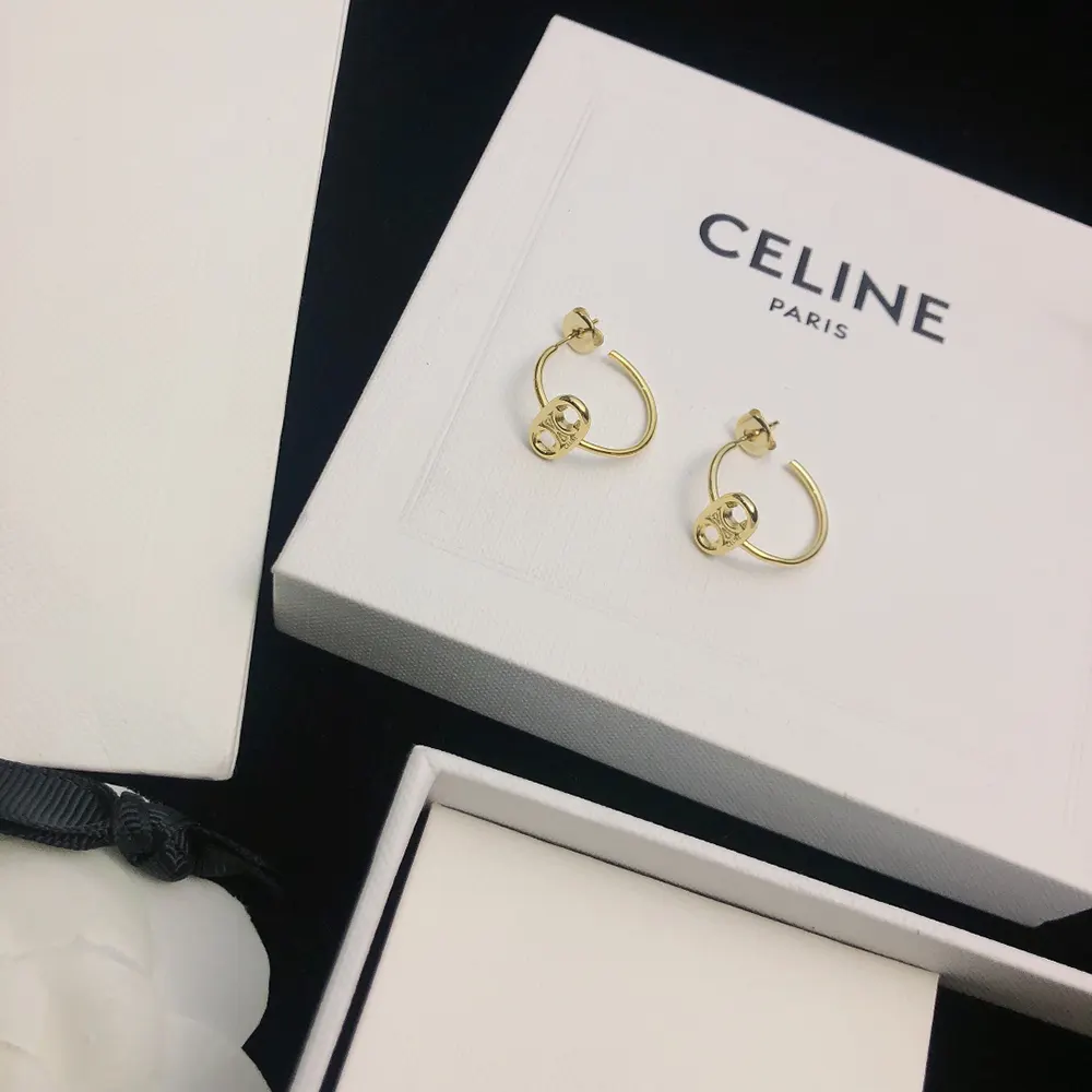 Model wearing Celine Women Maillon Triomphe Hoops with elegant outfit