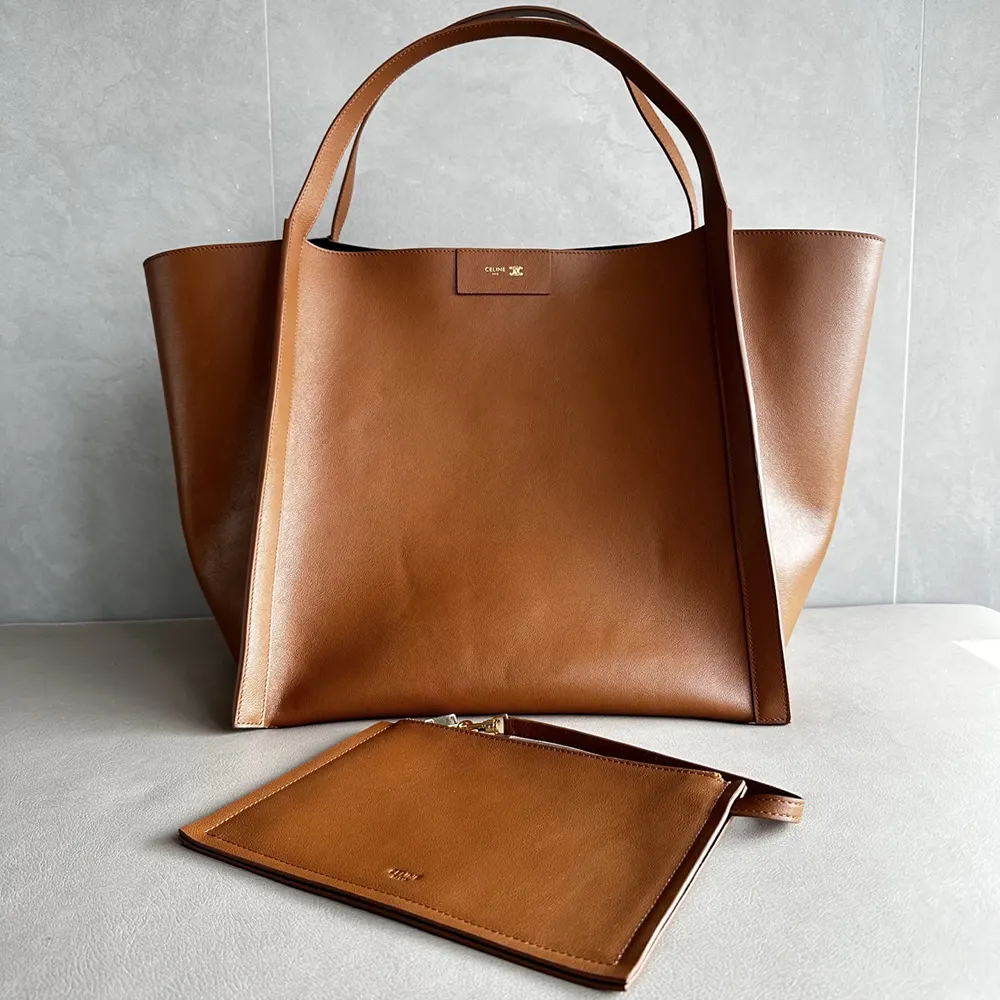 Close-up of gold-tone hardware on Celine Medium Cube Bag brown leather