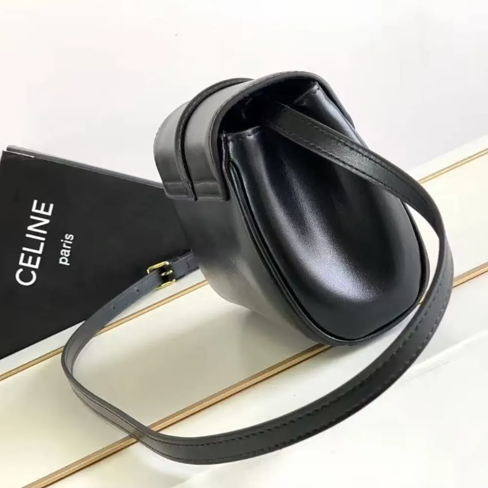Side profile showing soft silhouette of Celine Women Mini Soft 16 Black bag