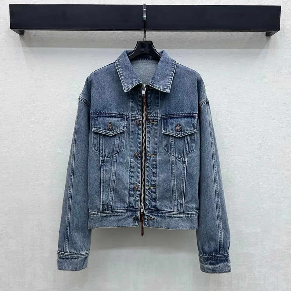 Close-up of metal buttons and embossed logo on Celine denim jacket