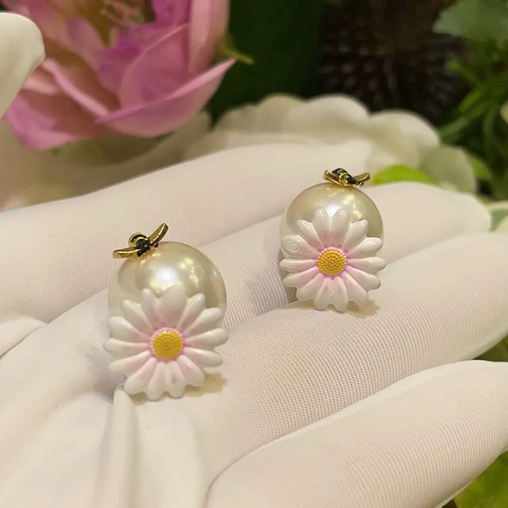 Pair of Dior Women Daisy Dior Tribales Earrings with push-back closure detail