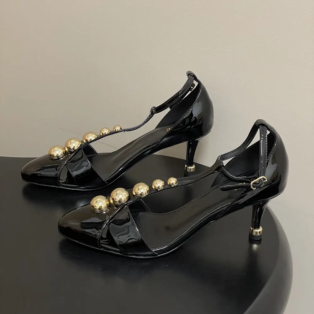 Front angle of Chloe Women Cleia Heeled Sandal-Black displaying smooth leather finish