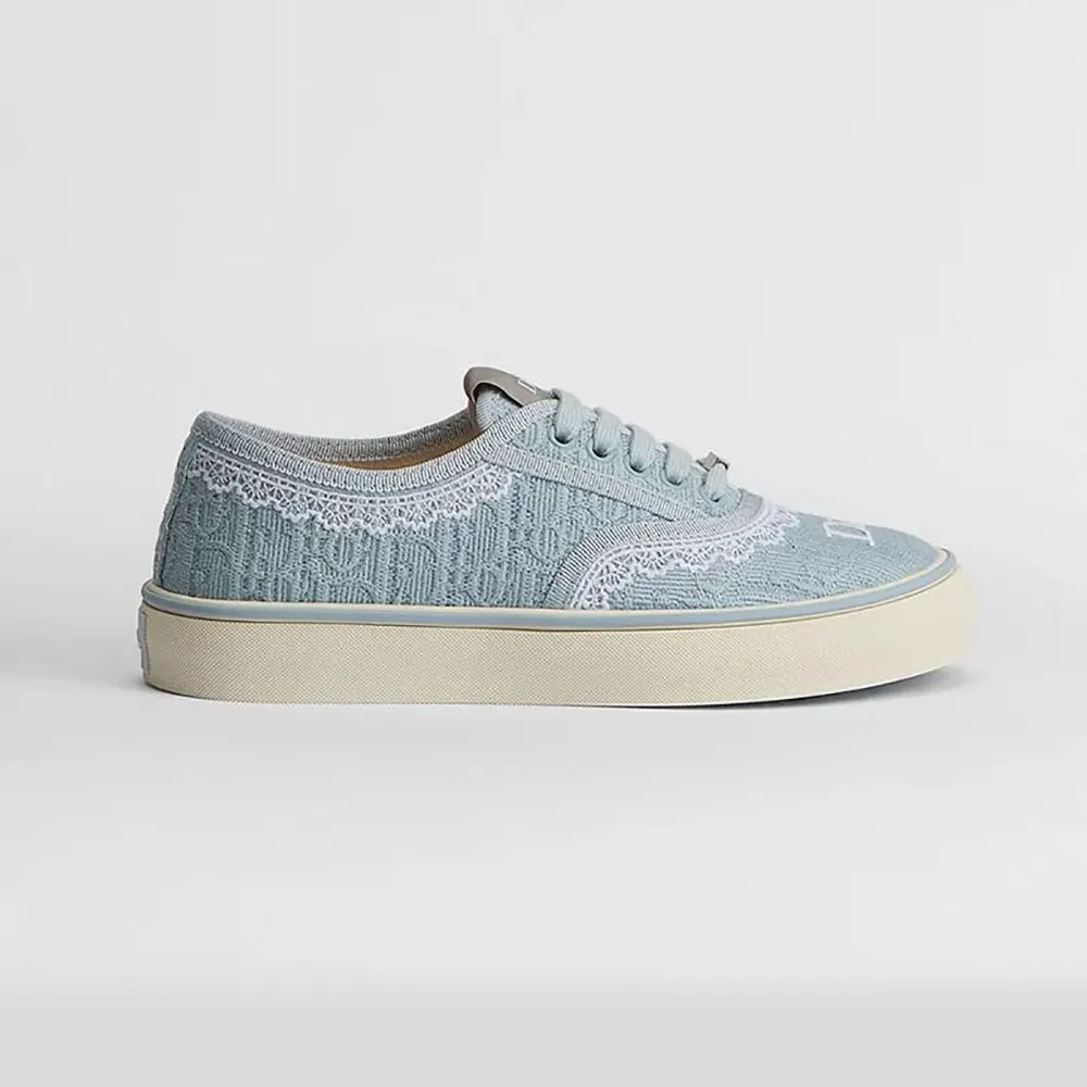 Side profile of Dior Unisex Saltwind Sneaker Bleu Ciel with Dior Oblique embroidery