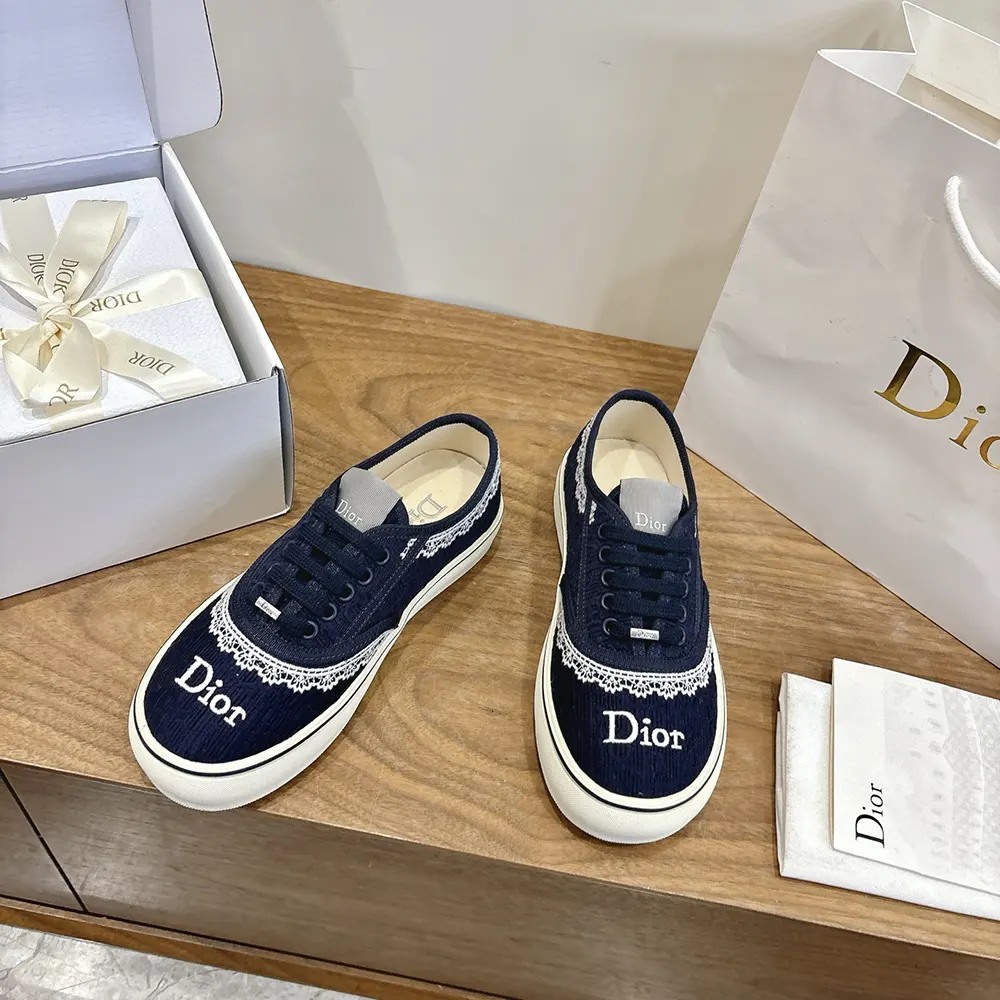 Top view showing signature Dior Oblique embroidery on Saltwind Sneaker in blue