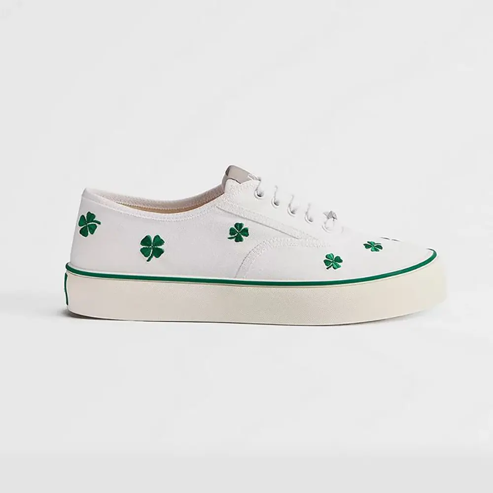 Side profile of Dior Unisex Saltwind Sneaker White Cotton with green clover