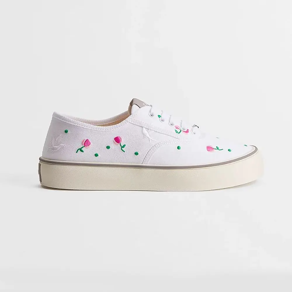 Side profile of Dior Unisex Saltwind Sneaker white cotton with doves embroidery