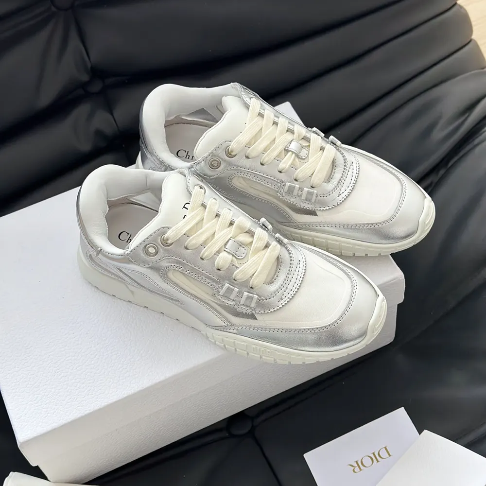 Close-up of transparent mesh and signature Dior emblem on sneaker