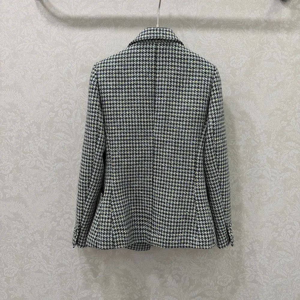 Side angle showing tailored silhouette of Dior Women Bar Jacket Black and White
