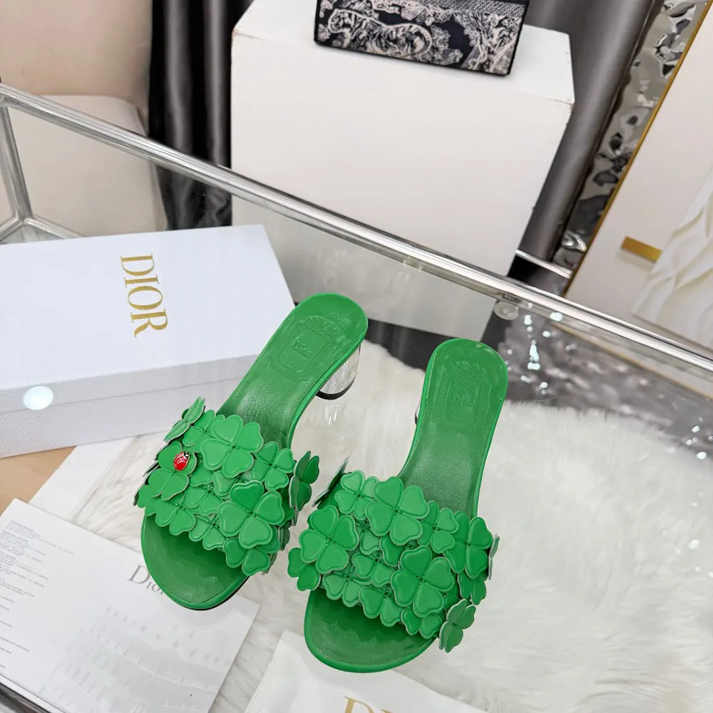 Close-up on green lambskin and Dior Clover embroidery detail on slide