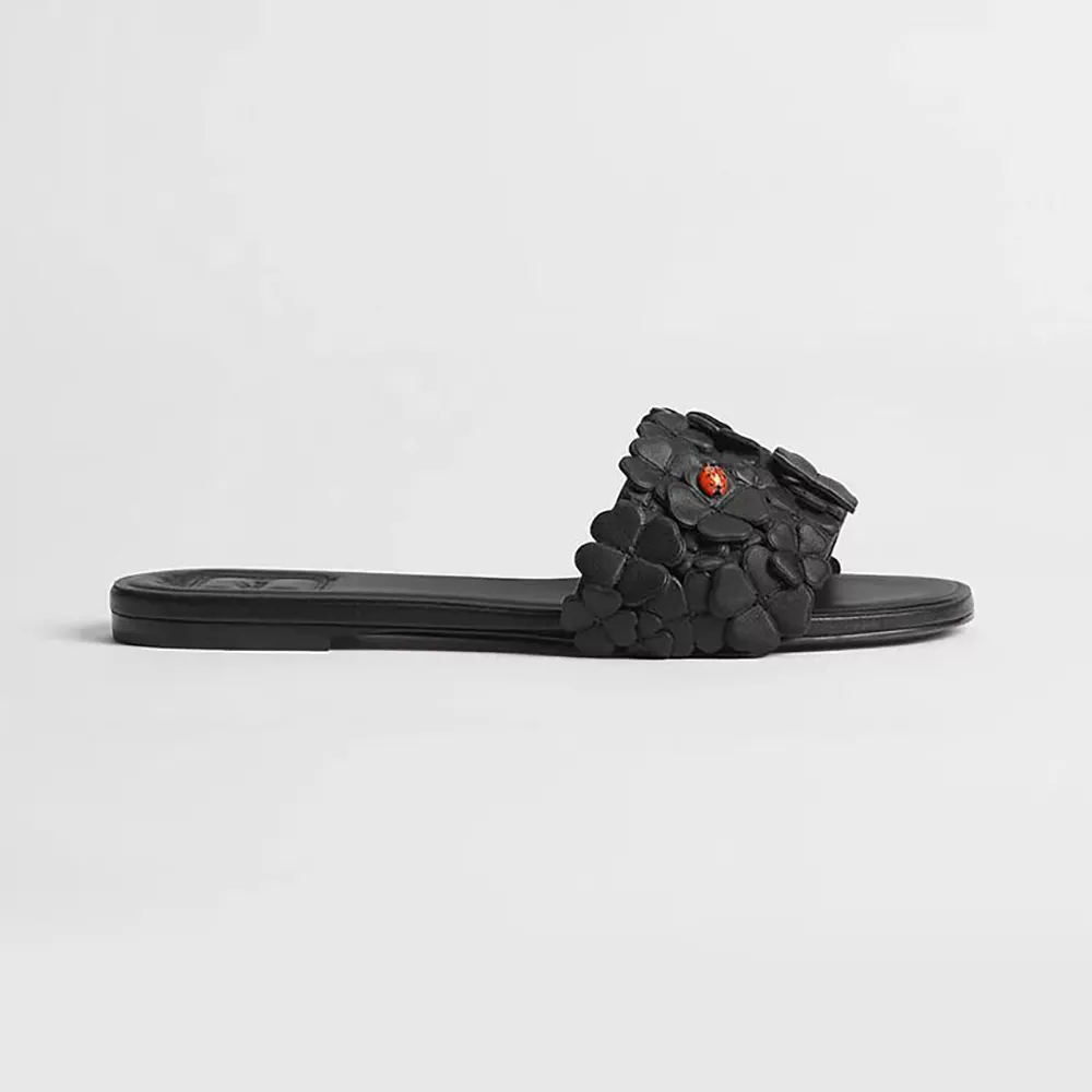 Side angle of Dior Women Bloom Slide black lambskin sandal