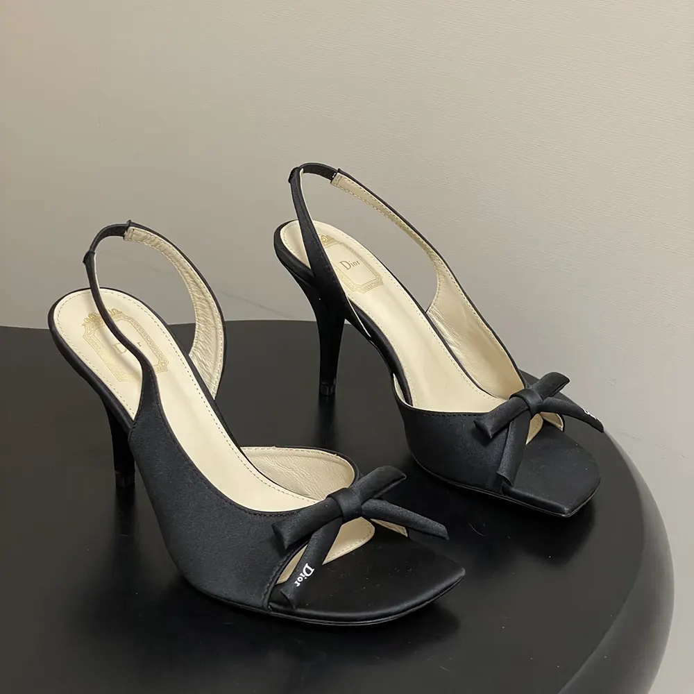 Close-up of black satin bow detail on Dior Women Dior Bow Heeled Slingback Sandal