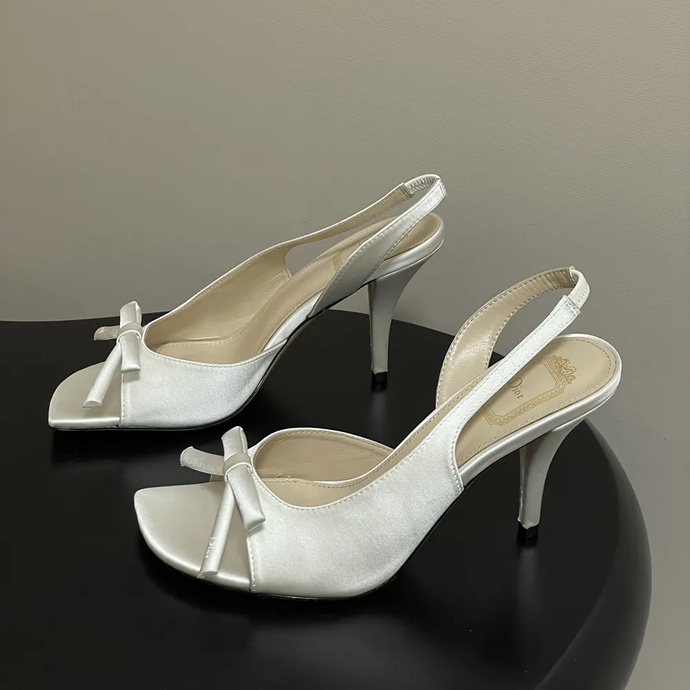 Rear angle showing adjustable slingback strap on Dior Women Dior Bow Heeled Slingback Sandal