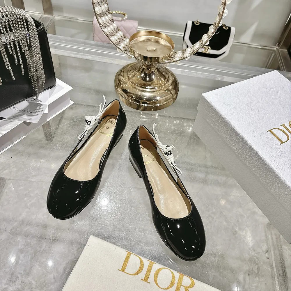 Close-up of Dior signature bow on J’Adior Ballet Flat in black