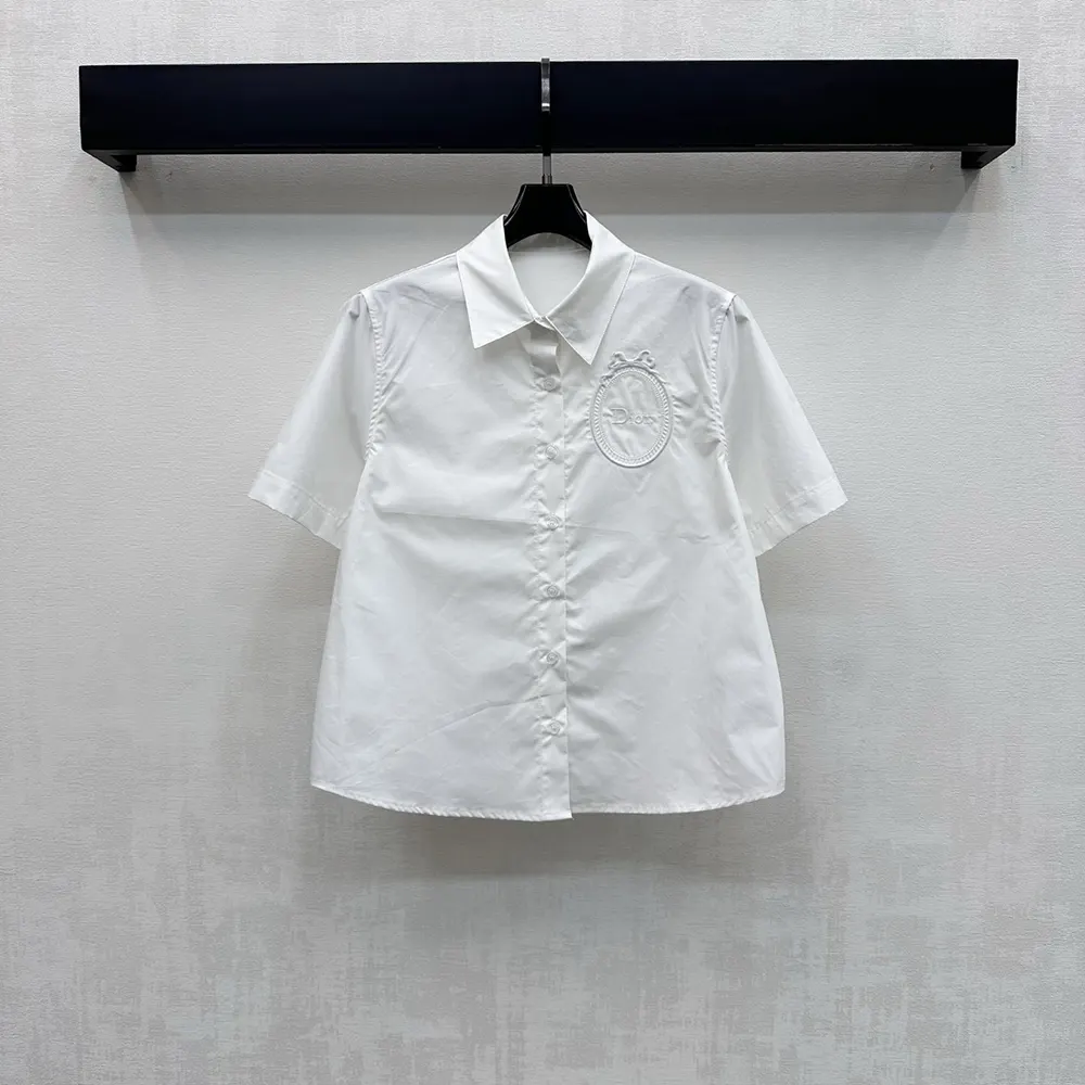 Close-up of embroidered medallion detail on Dior Women Médaillon blouse