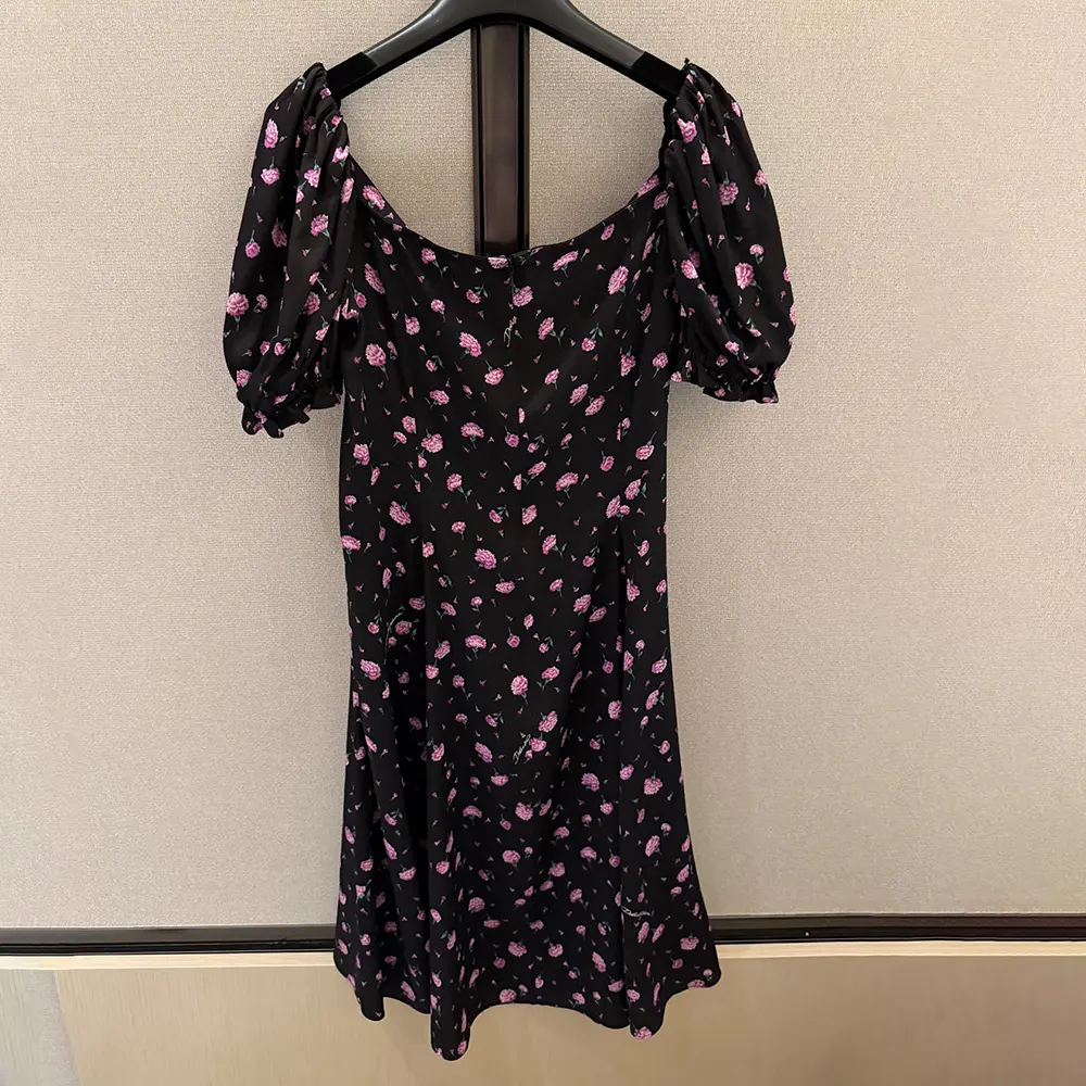 Side angle highlighting silhouette of Dolce Gabbana D&G Women Carnations-Print Dress