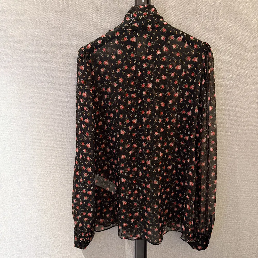 Side profile showing drape and flow of Dolce Gabbana D&G Small Rose-Print Top