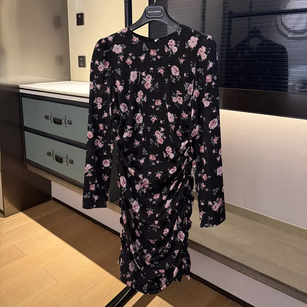 Side angle showing silhouette and D&G logo hardware on vintage rose-print dress