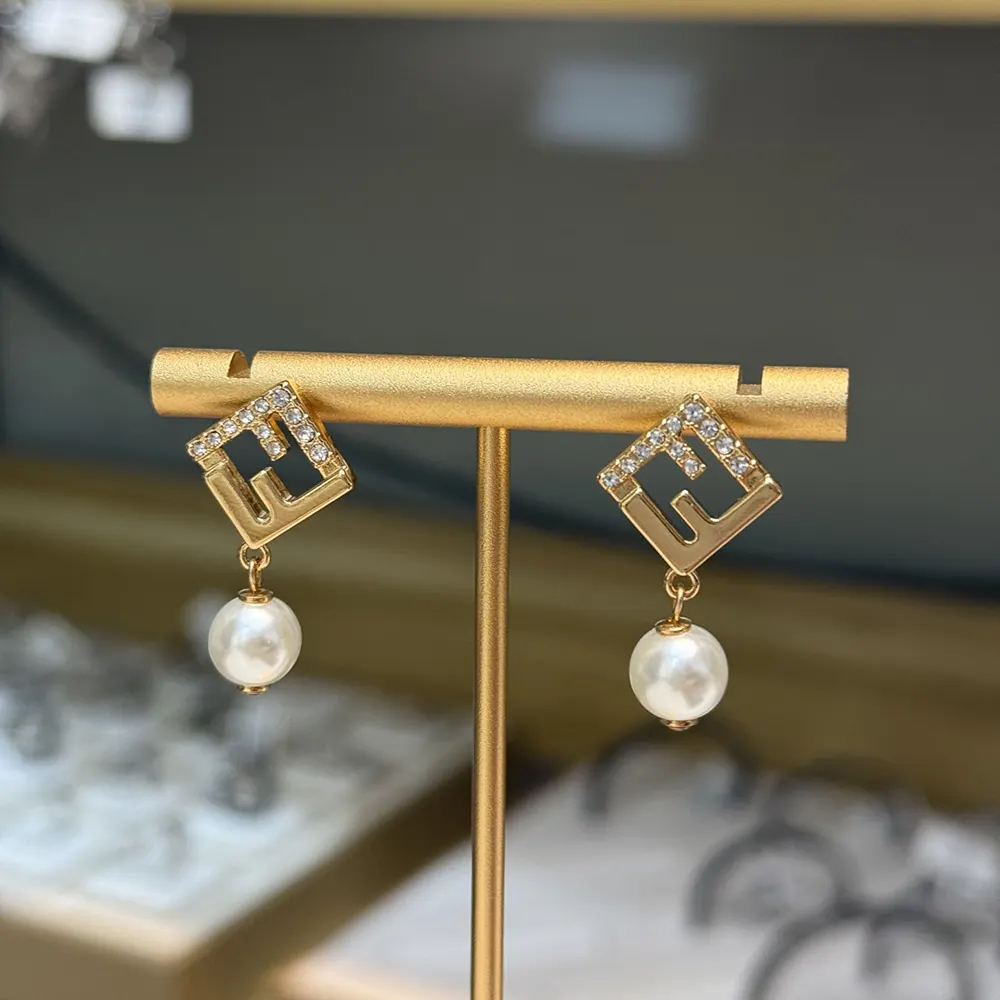 Close-up detail showing pearls and crystals on Fendi Earrings