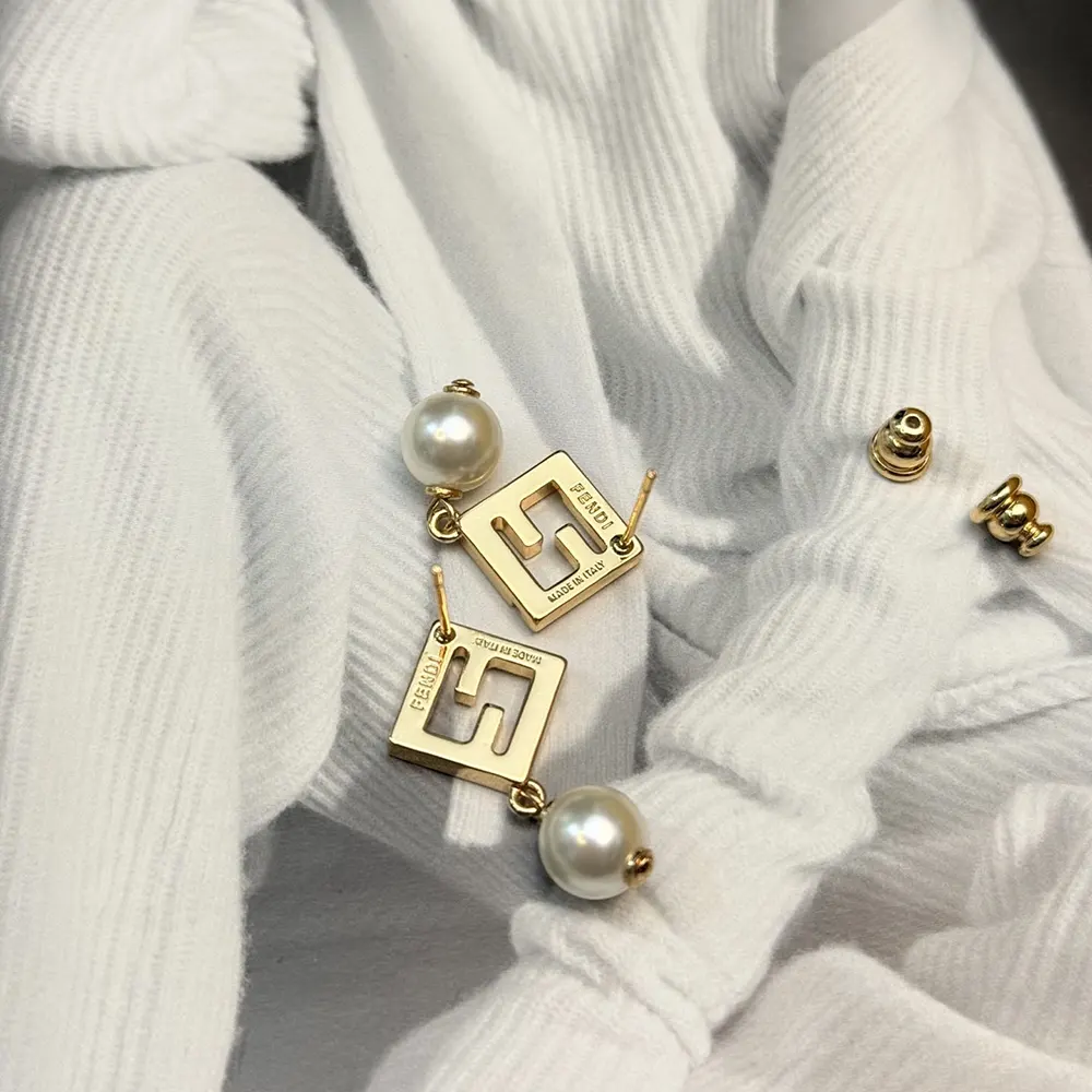 Side angle of Fendi Women Forever Fendi Earrings highlighting closure