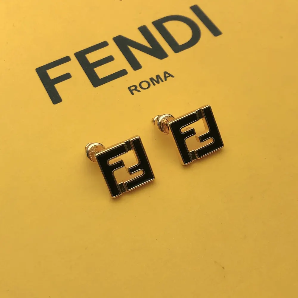 Close-up detail of gold-colored hardware on Fendi Women Forever Fendi Earrings