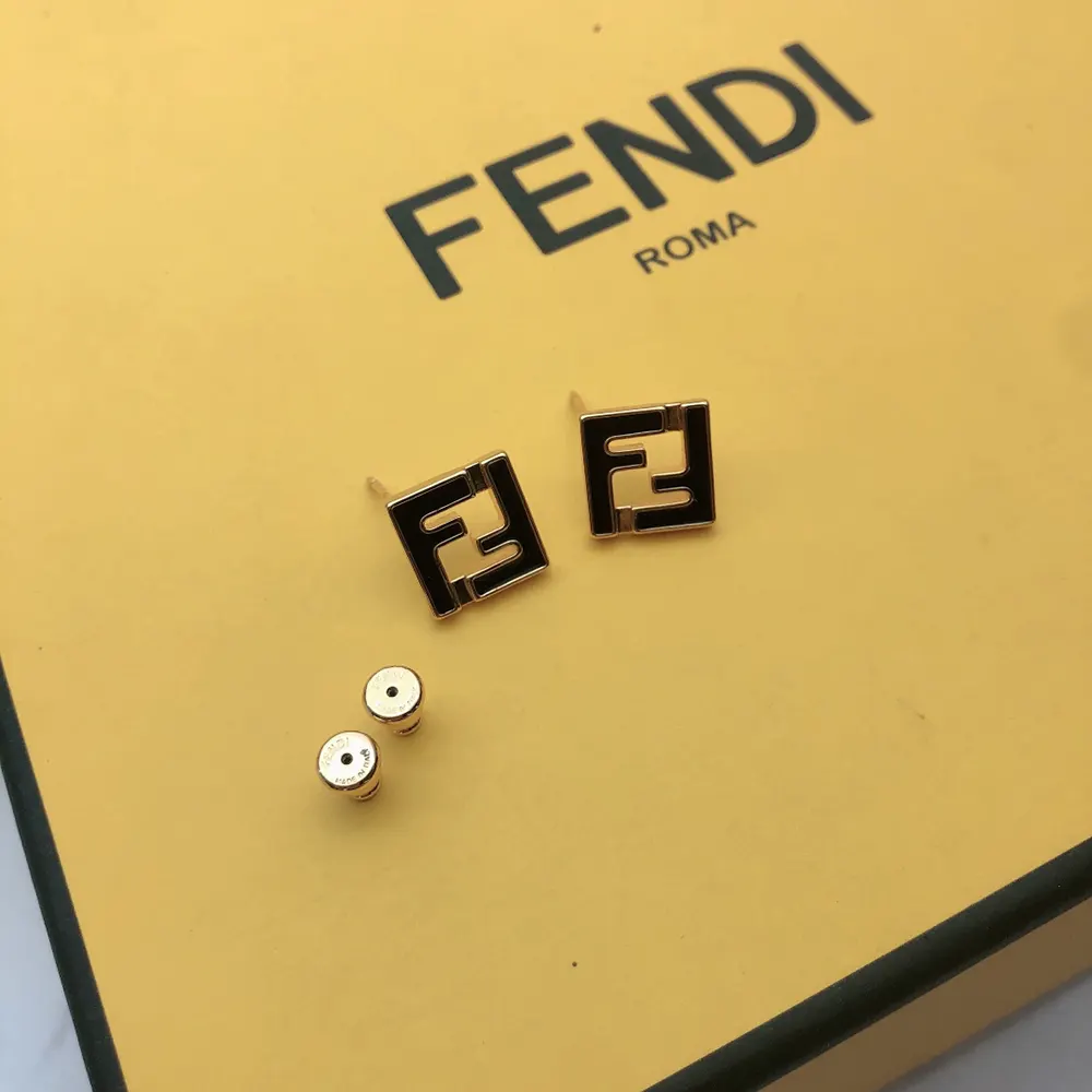 Side angle showing black metal silhouette of Fendi Women Forever Fendi Earrings