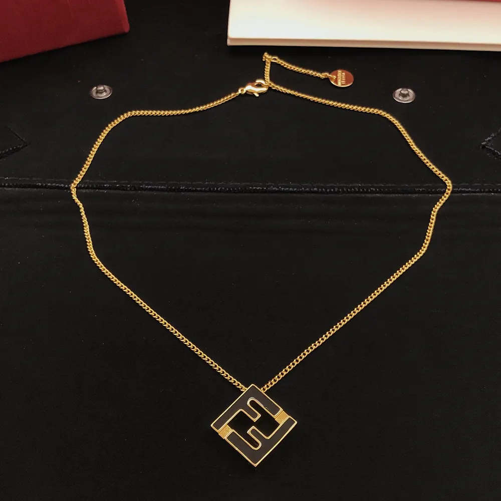 Angled shot highlighting Forever Fendi logo on gold-colored necklace