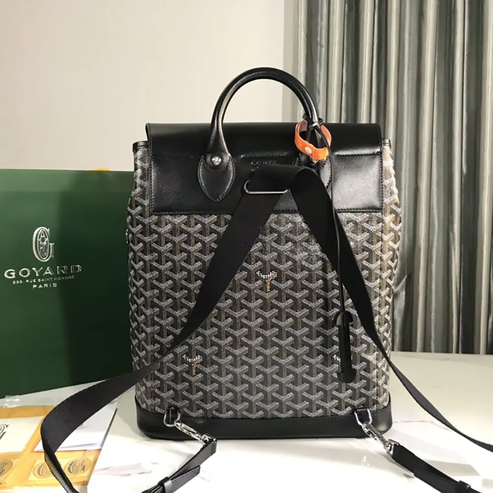 Side angle of Goyard Unisex Alpin MM Backpack-Black highlighting adjustable straps