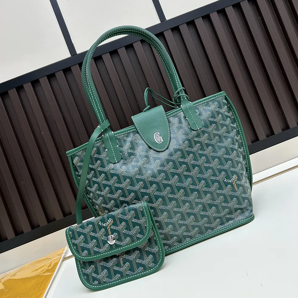 Close-up of green leather trim and brass hardware on Goyard Anjou Mini Bag