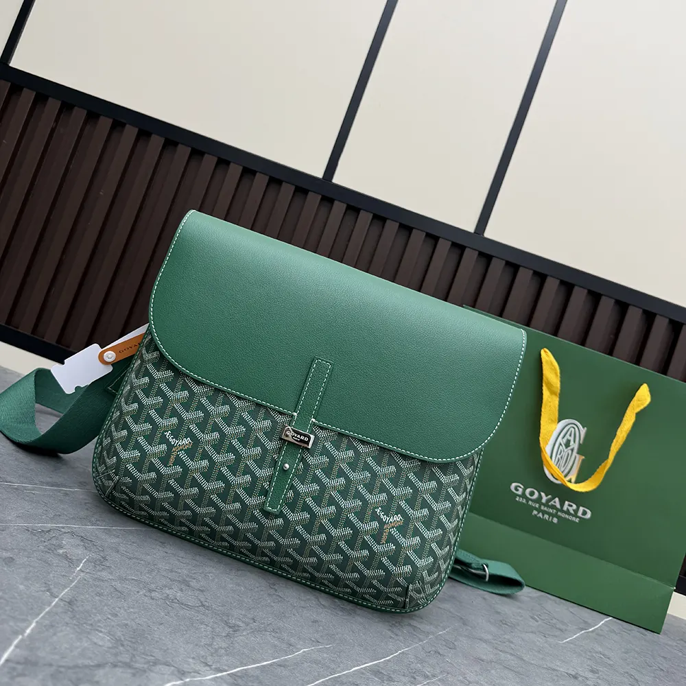 Close-up of brass hardware and signature chevron on Goyard messenger bag