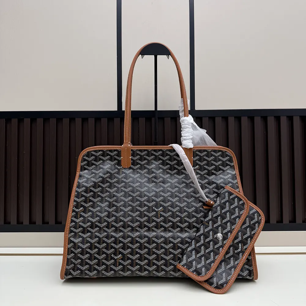 Close-up of gold-tone hardware on Goyard Unisex Hardy Pm Bag-Tan