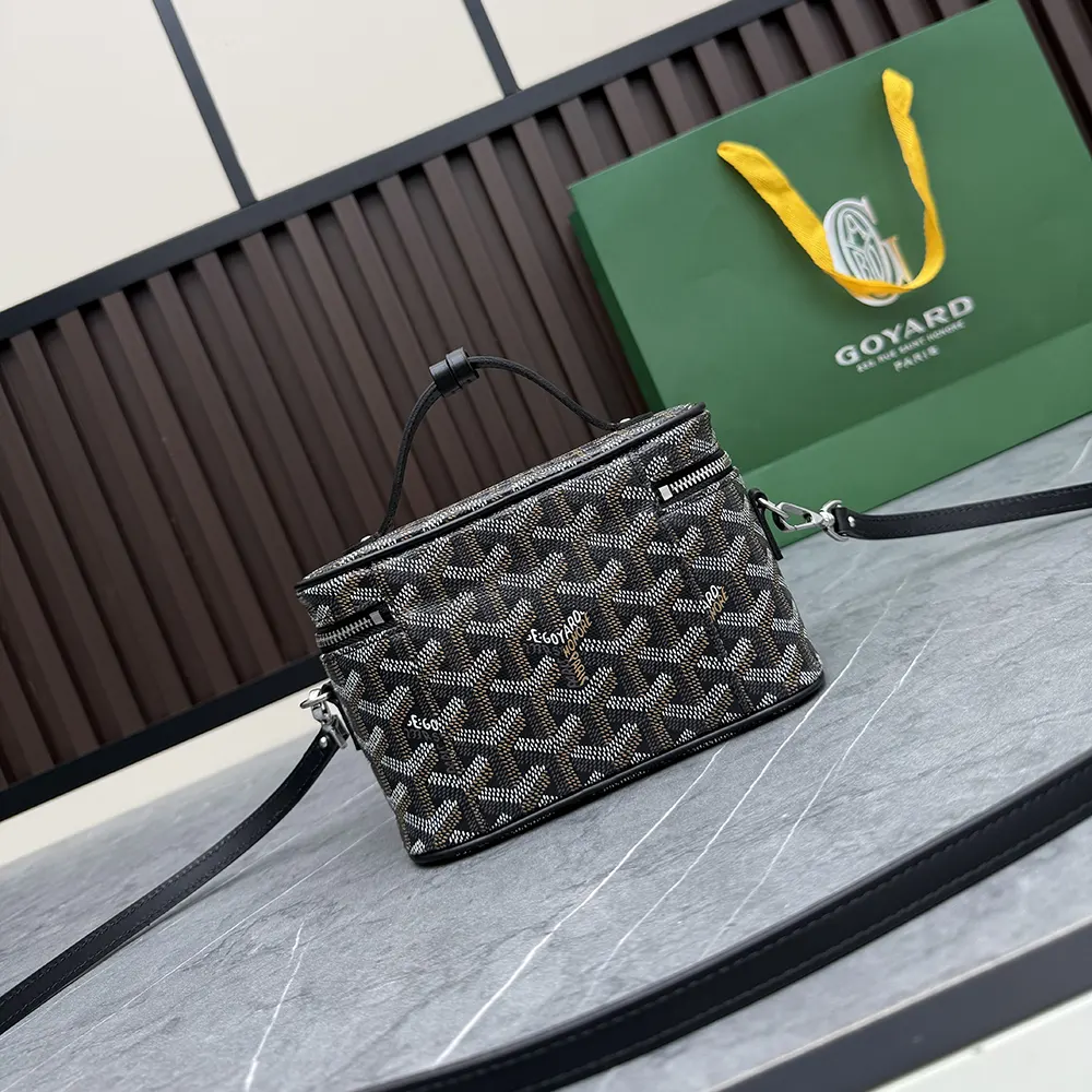 Side profile of Goyard Unisex Muse Mini Vanity-Black with adjustable shoulder strap