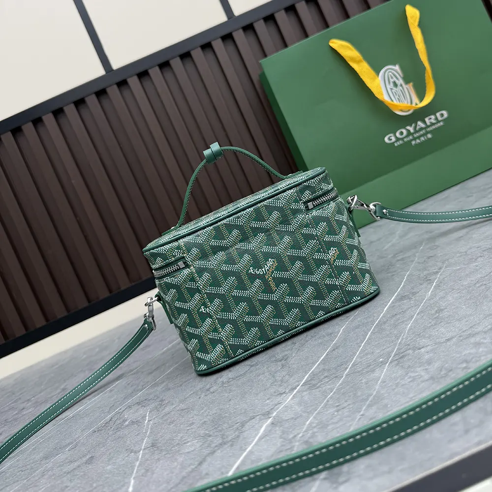 Close-up of Goyard Unisex Muse Mini Vanity-Green Chevron pattern and gold clasp
