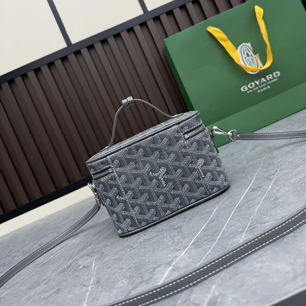 Side profile of Goyard Unisex Muse Mini Vanity-Grey with leather trim details