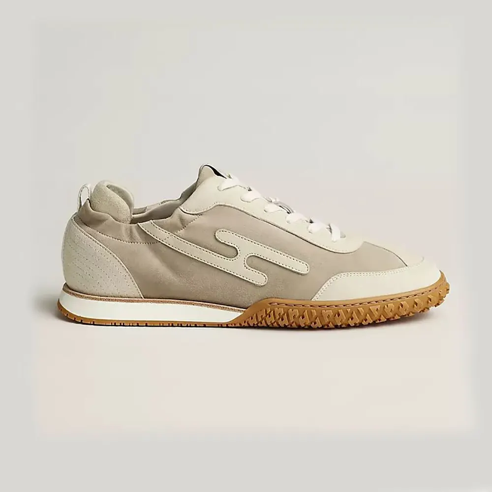 Side profile of Hermes Unisex Jet Sneaker in beige technical canvas