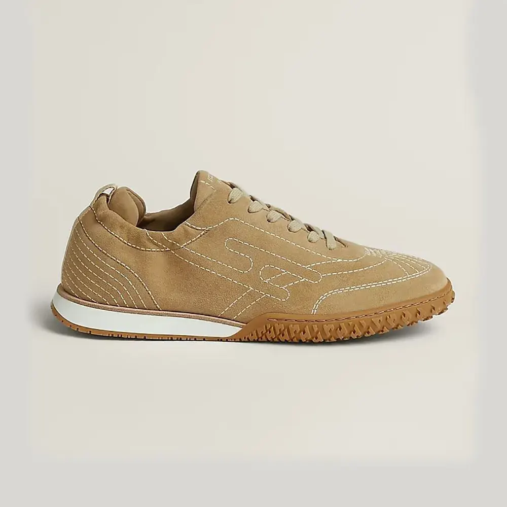 Side profile of Hermes Unisex Jet Sneaker in natural canvas and suede