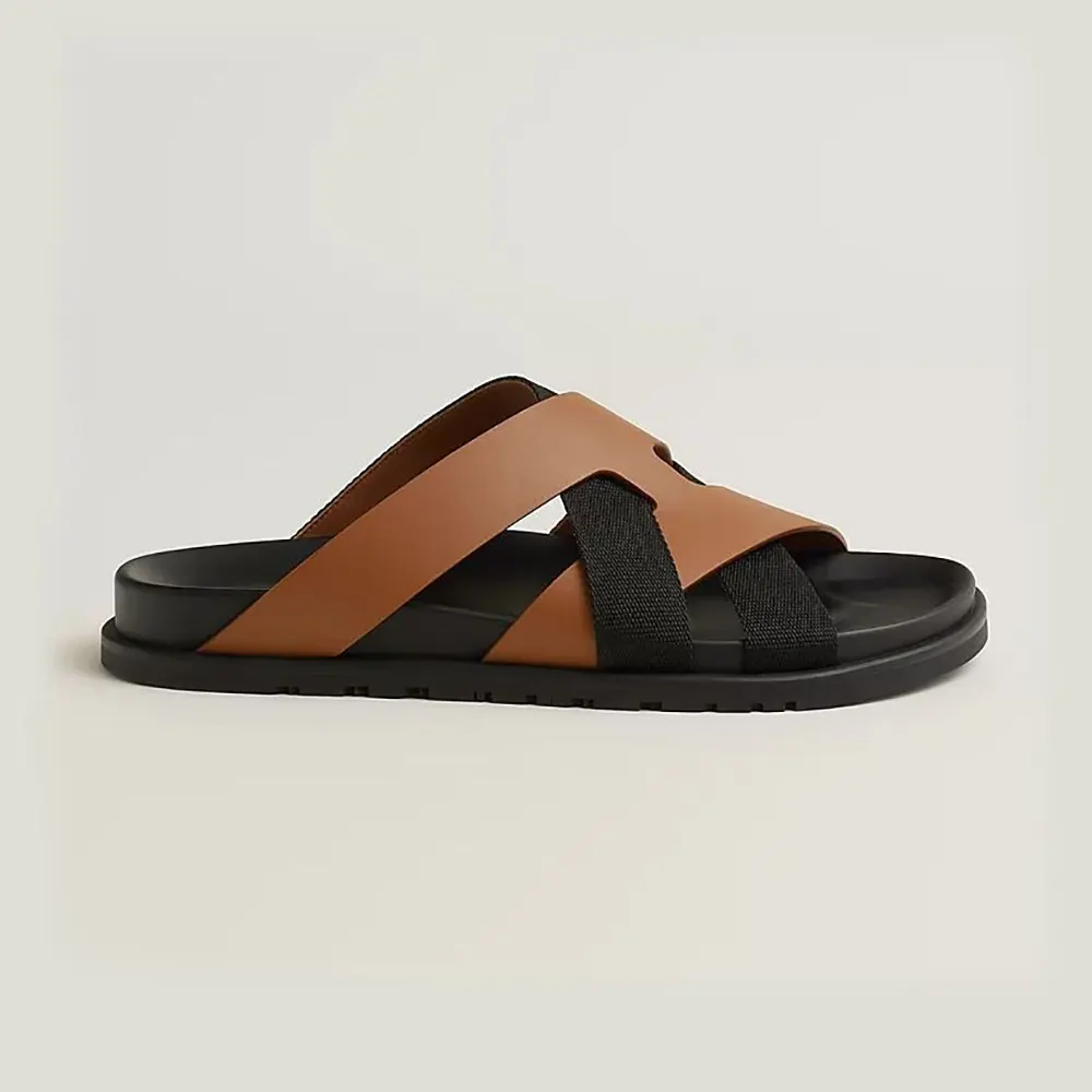 Side profile of Hermes Unisex Kazimir Sandal-Brown/Black showing leather detail