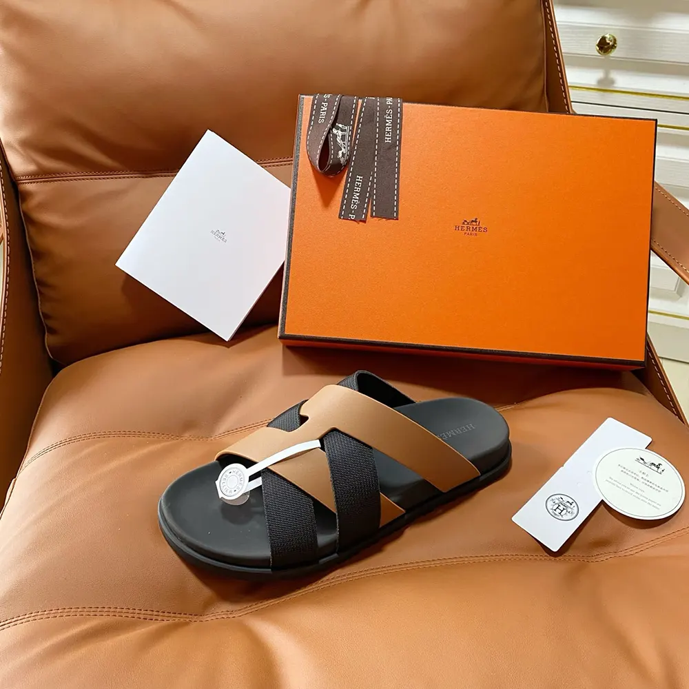 Close-up of brown leather and black accents on Hermes Unisex Kazimir Sandal