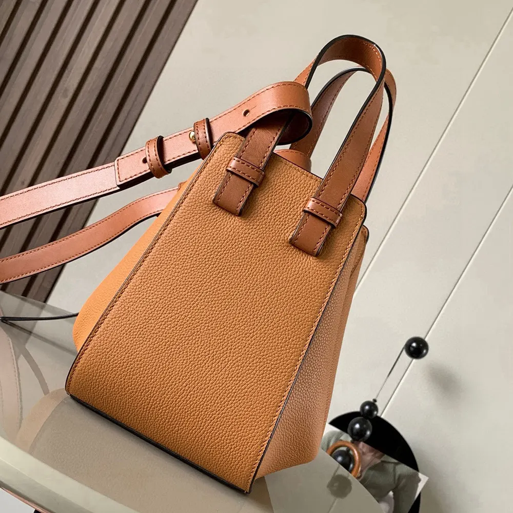 Side angle showing silhouette and zipper closure of Loewe Compact Hammock Bag