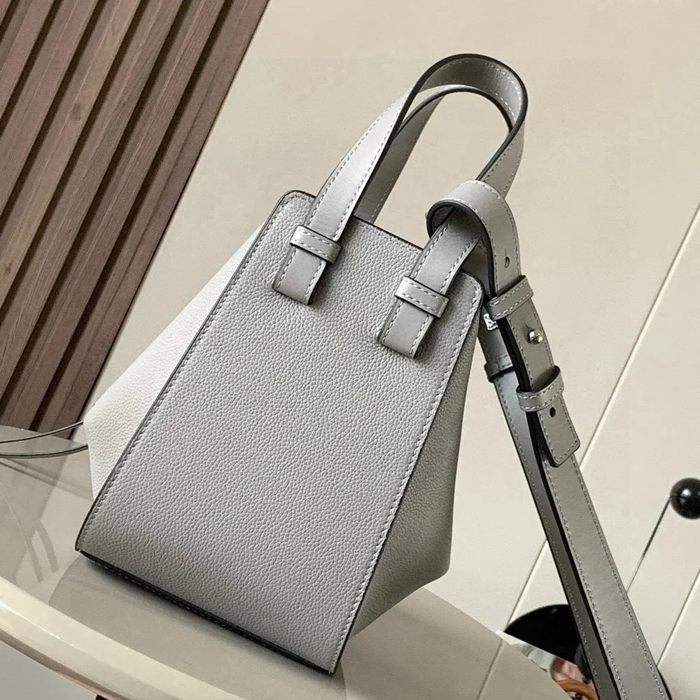Side angle showing silhouette of Loewe Unisex Compact Hammock Bag in silver