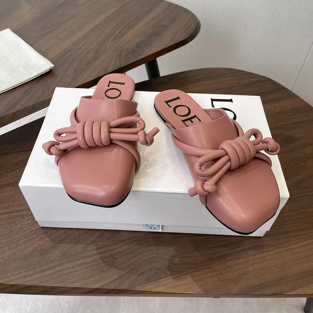 Overhead view highlighting pink leather and sleek silhouette of Loewe mule