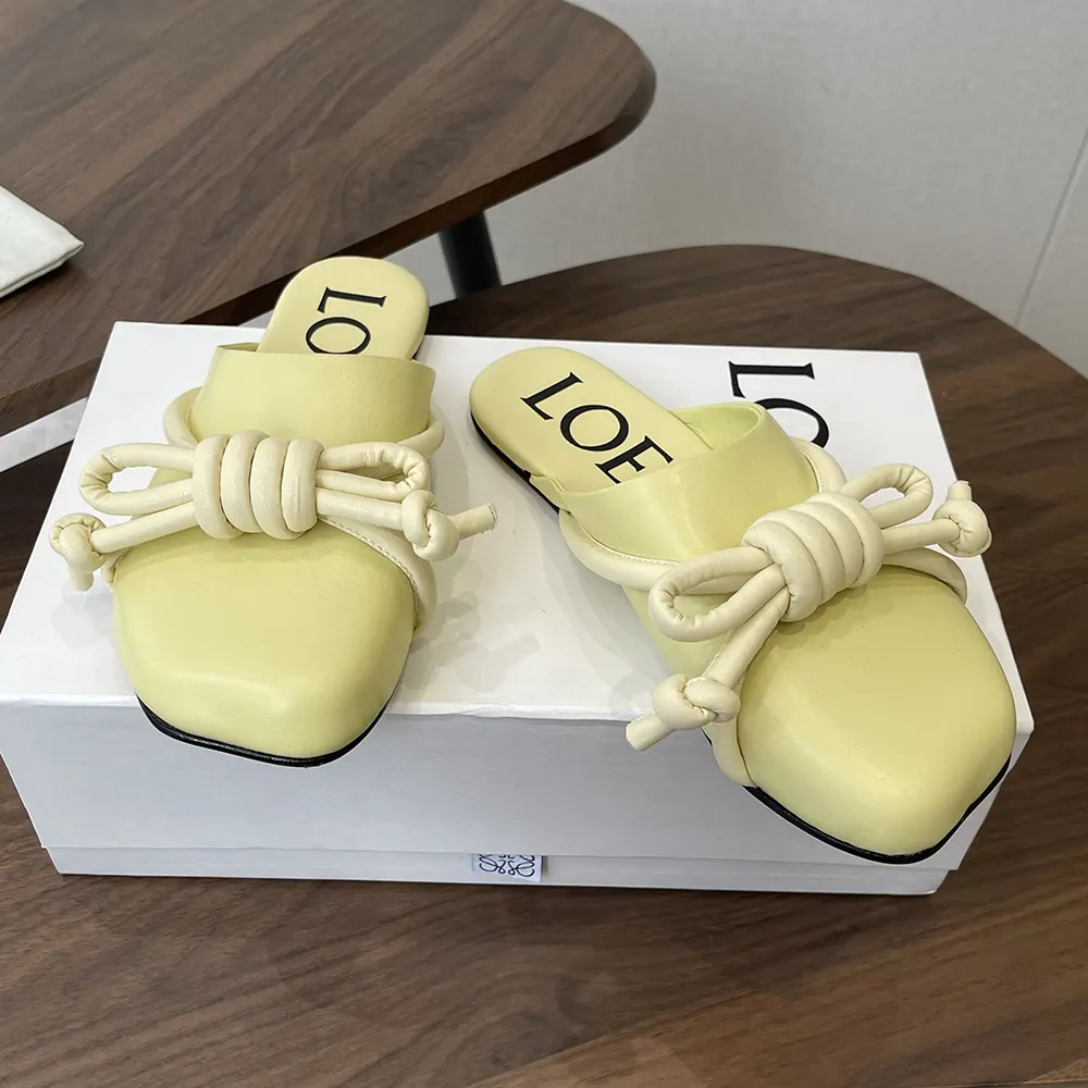 Top angle showing soft yellow lambskin on Loewe Women Flamenco Knot Mule