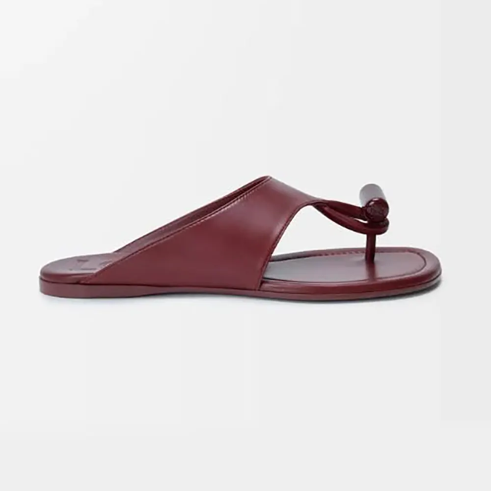 Side angle of Loewe Women Toggle Flat Sandal in Burnt Red leather