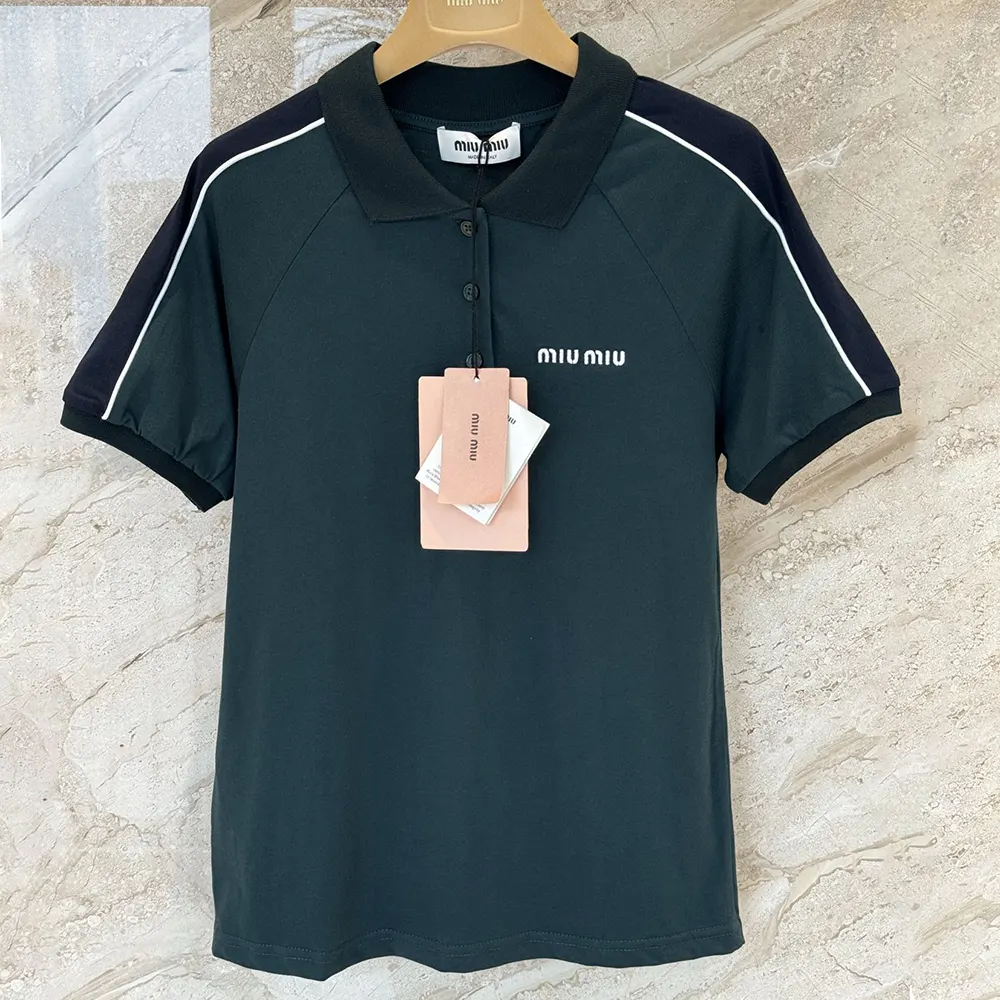 Side angle showing slim tailored fit of Miu Miu green polo shirt